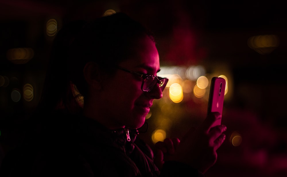 woman using silver iPhone