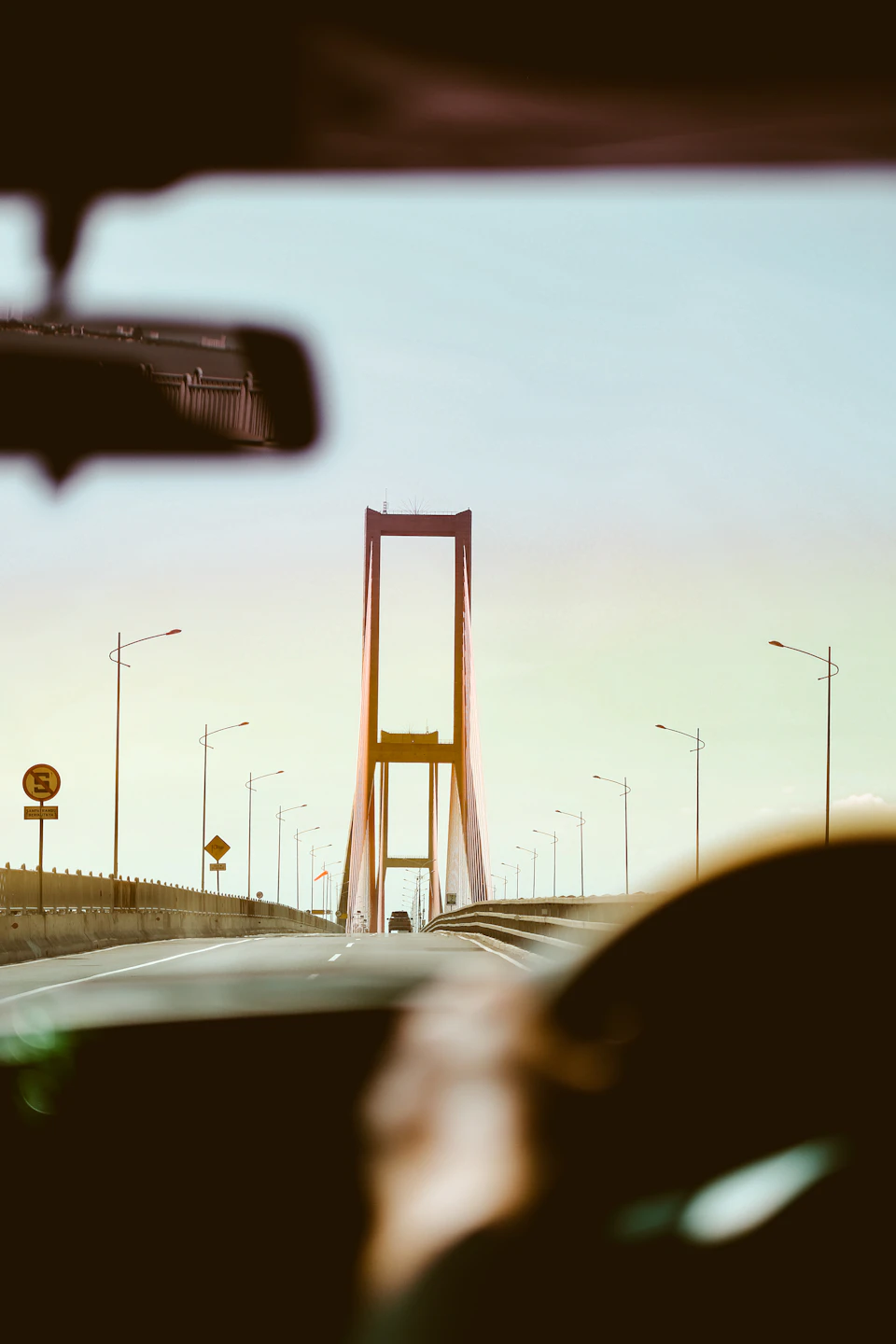 View from inside car looking out at suspension-style Bosphorus Bridge in Istanbul, Turkey