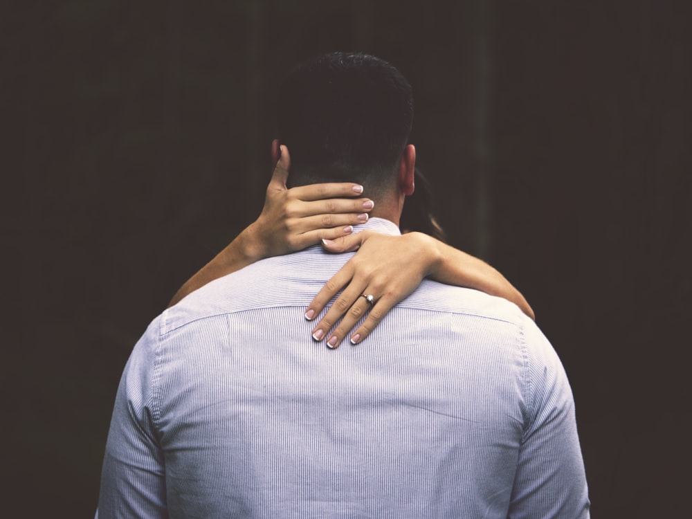 person hugging man