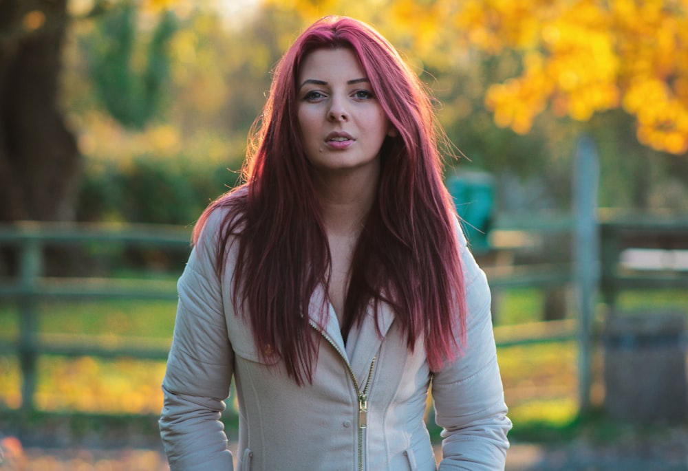 woman in gray zip-up jacket