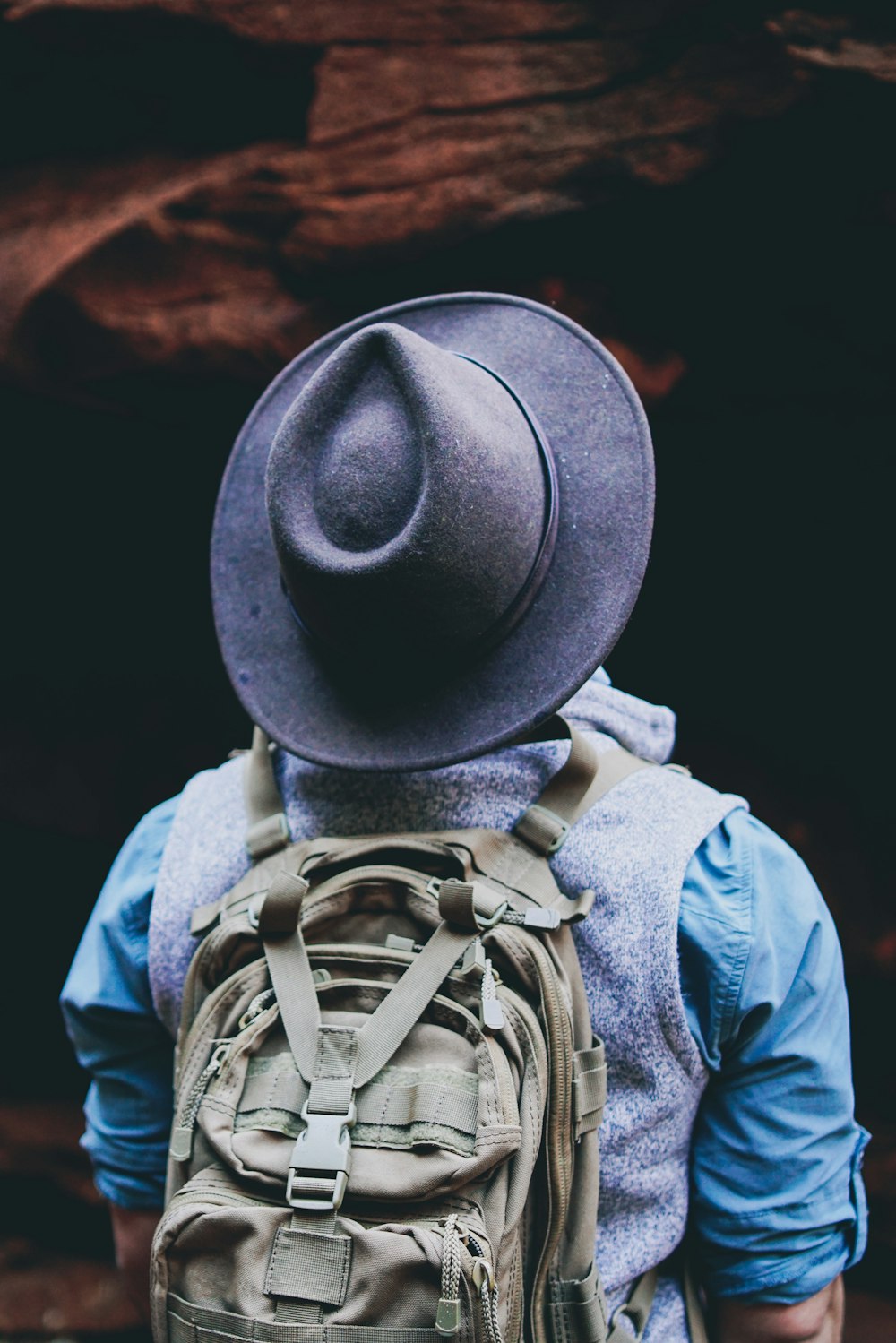 man wearing black hat with backpack