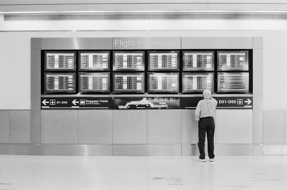 man looking at the flight information