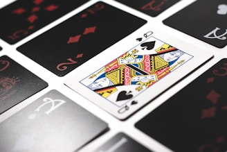 Close-up of cards being arranged in a winning rummy sequence.