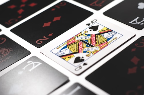 Close-up of cards being arranged in a winning rummy sequence.
