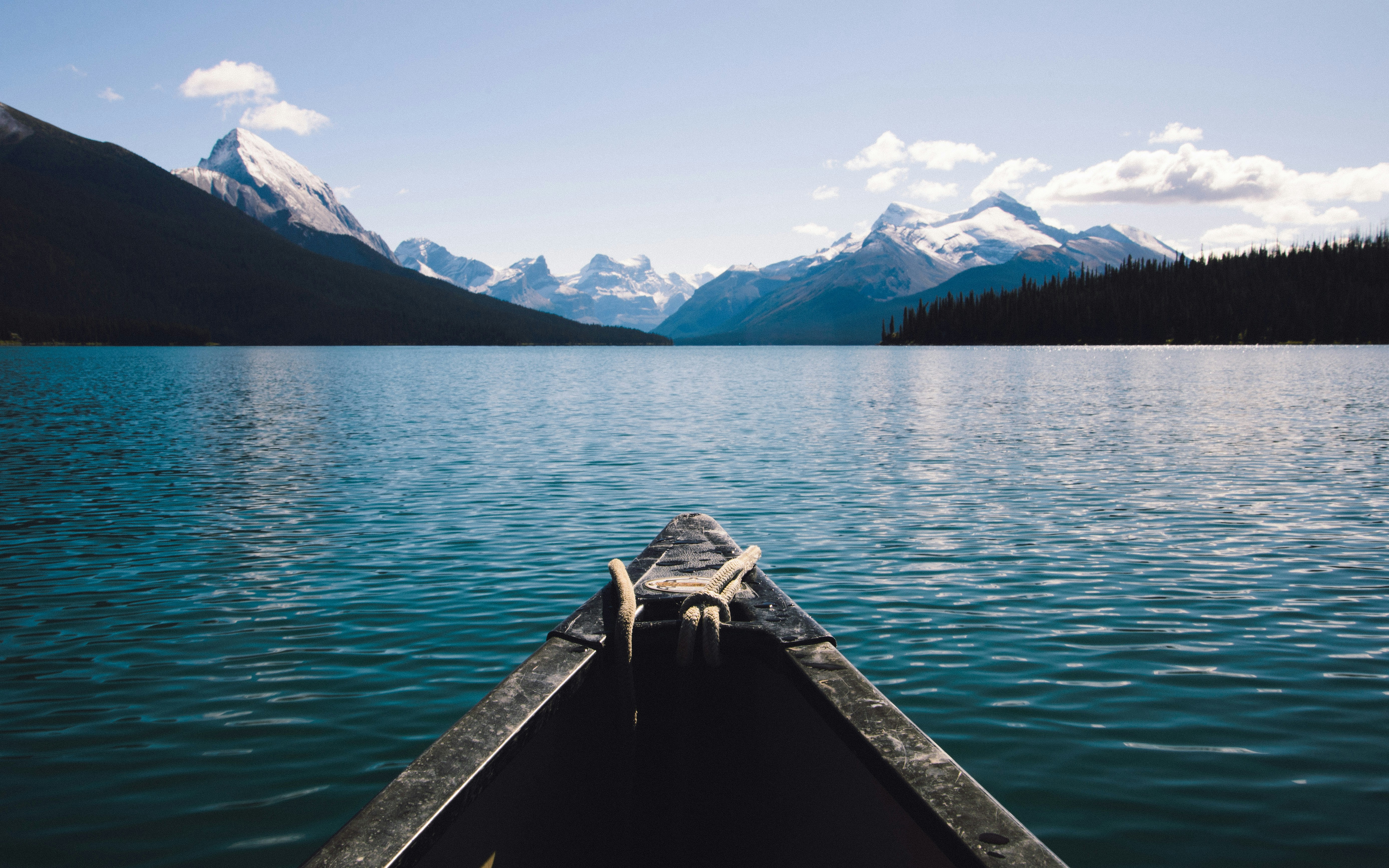 Tip of canoe over a lake