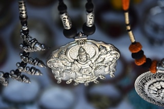 silver-colored pendant
