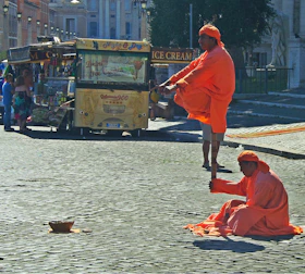 Audience amazed by a magical levitation act in a modern setting.