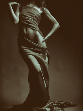 Silhouette of a woman’s body highlighting smooth contouring results in nude beige tones.