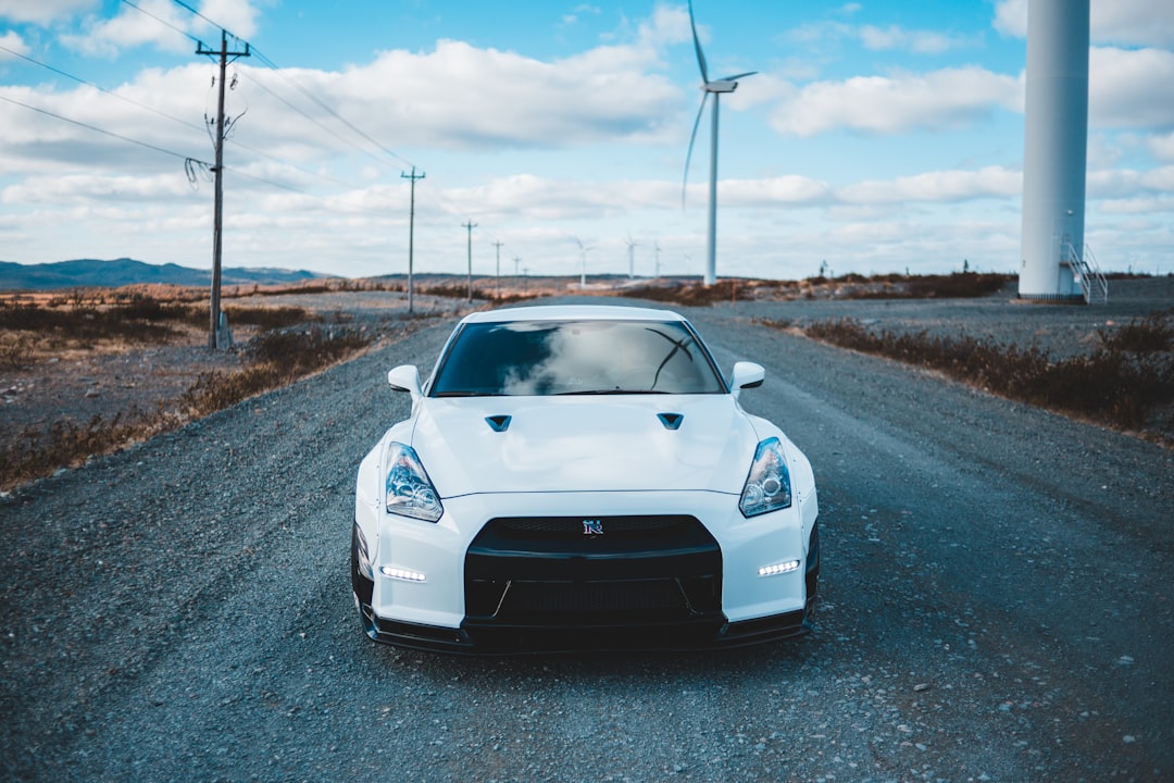white Nissan GT-R coupe on road during daytime