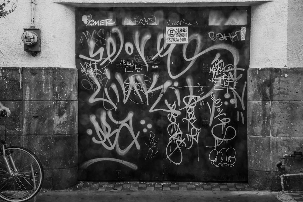 grayscale photography of graffiti