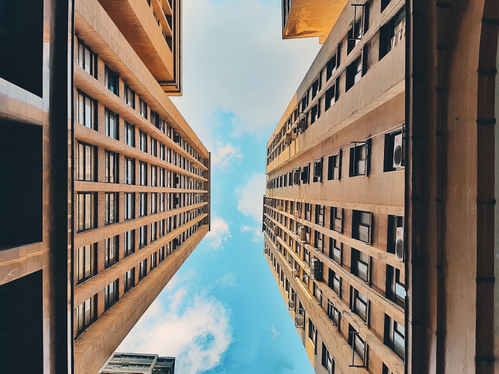 low-angle photography of brown concrete building during daytime