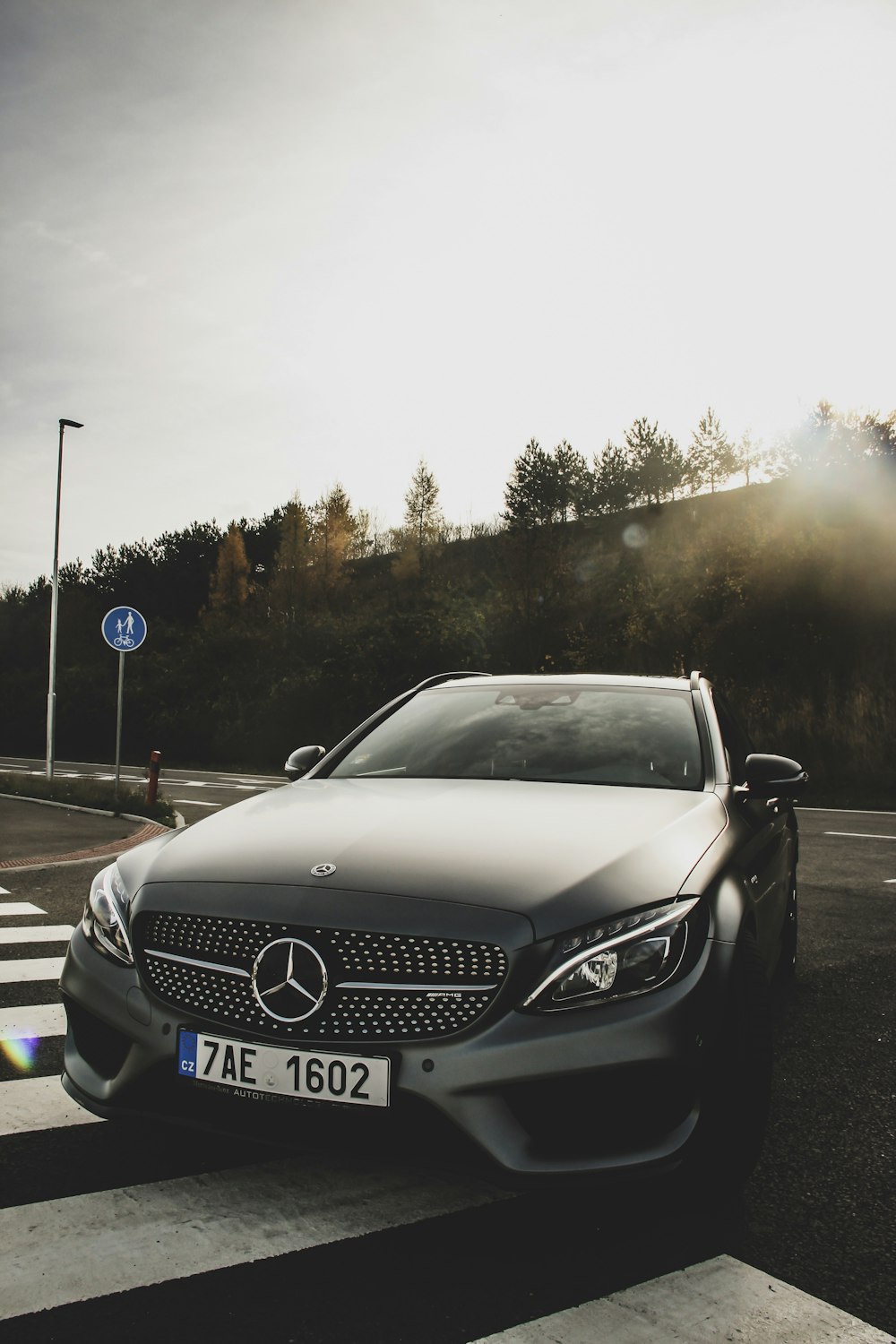 black Mercedes-Benz car on road