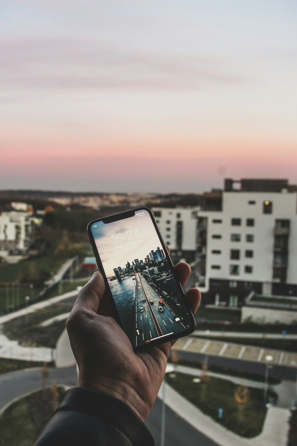 person holding space gray iPhone X on focus photography