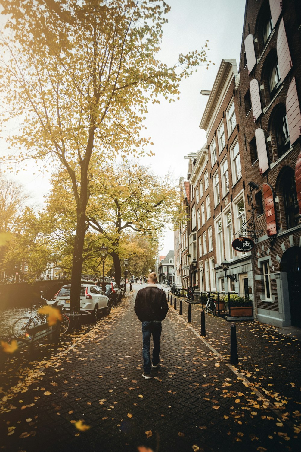 man walking near houses