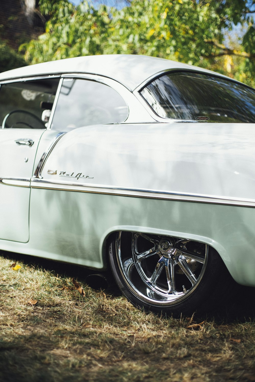 white and teal coupe