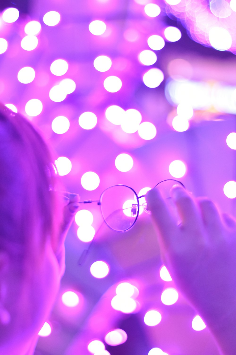 person holding eyeglasses