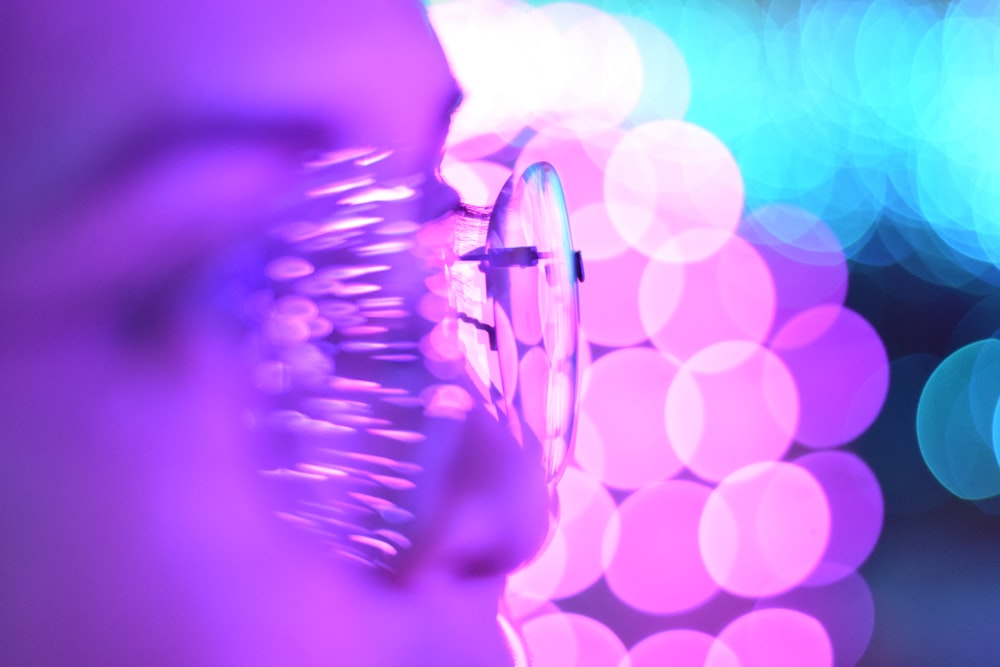a close up of a person's eye with a blurry background