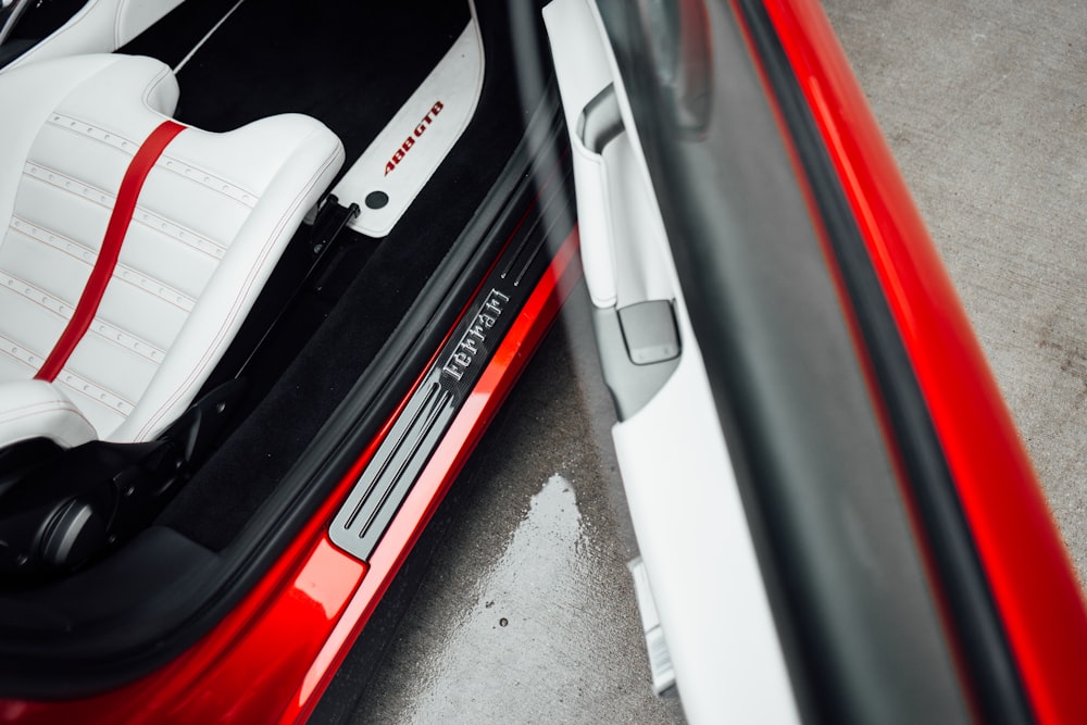 the interior of a red sports car