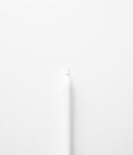 a white toothbrush on a white surface
