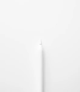 a white toothbrush on a white surface
