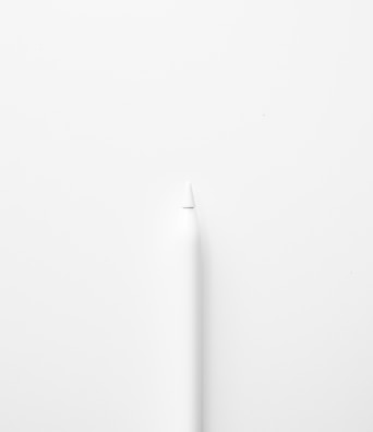 a white toothbrush on a white surface