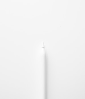 a white toothbrush on a white surface