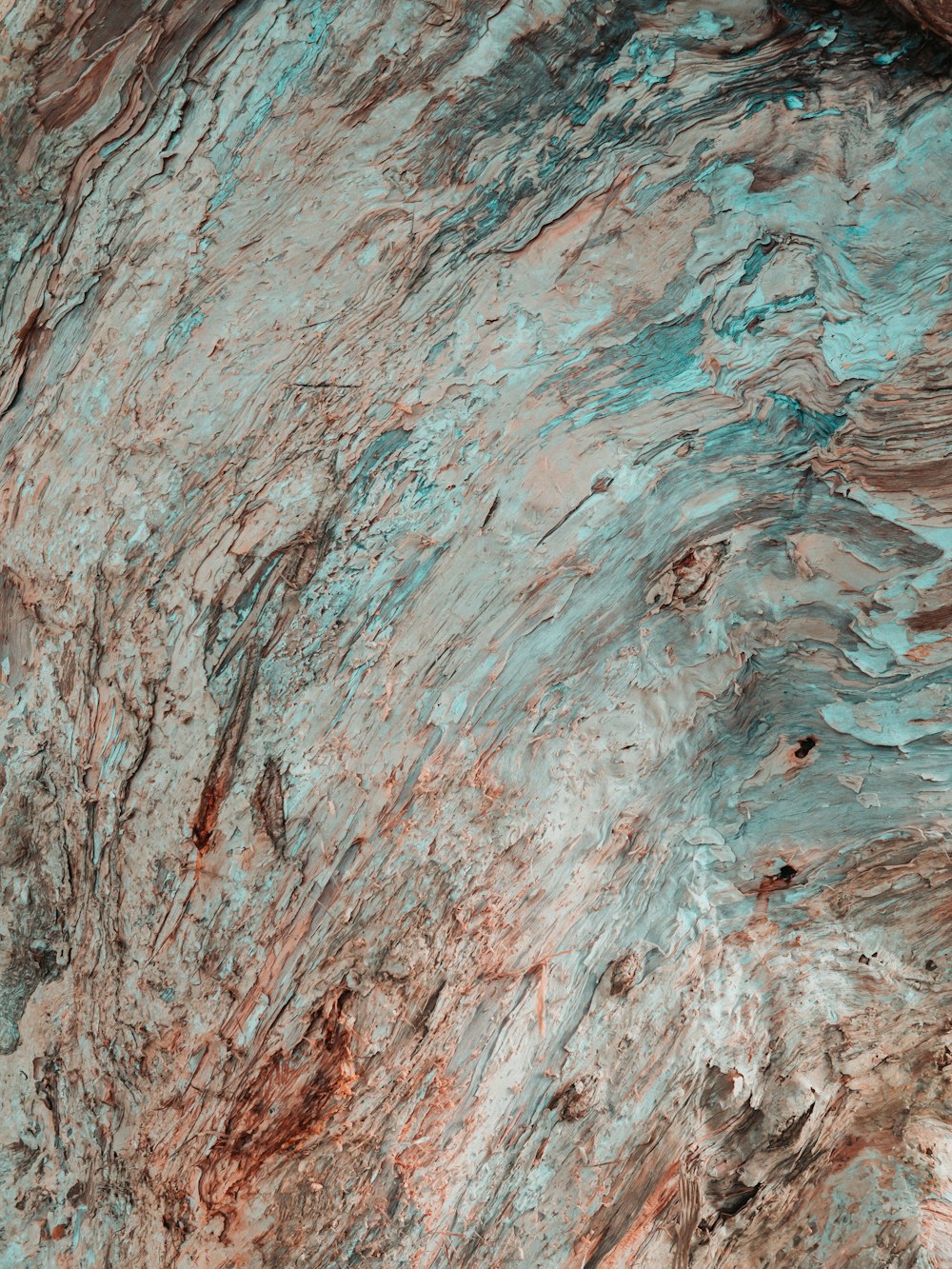 red and blue rock in closeup photo
