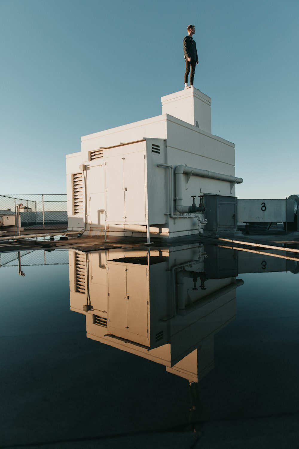 man standing at rooftop