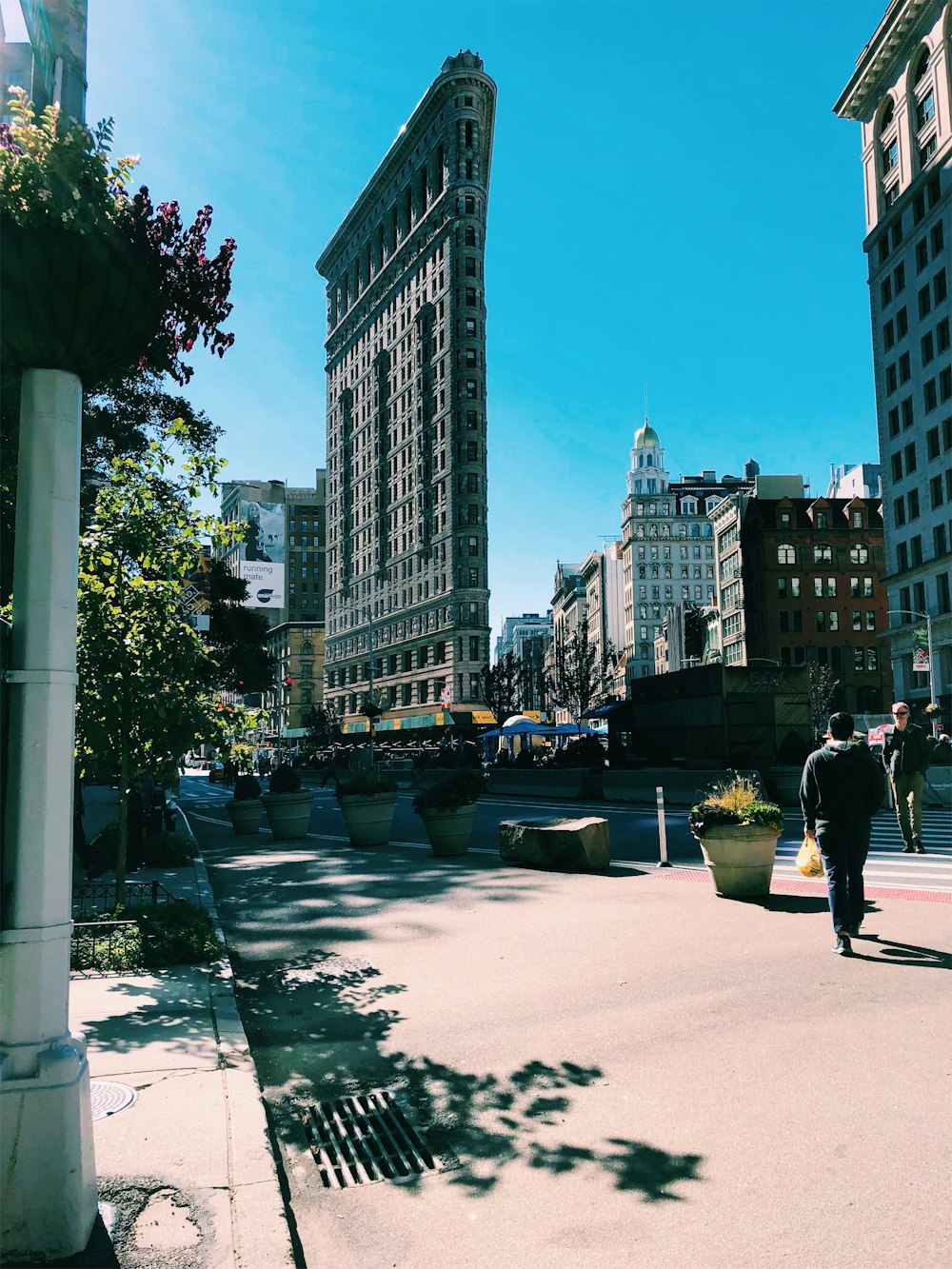 man in black shirt walking on street