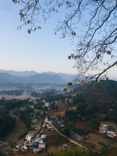 Close-up of natural landscapes around the village with rich green fields and traditional houses.