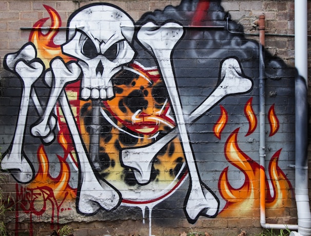 Graffiti art of a pirate radio theme on a brick wall.