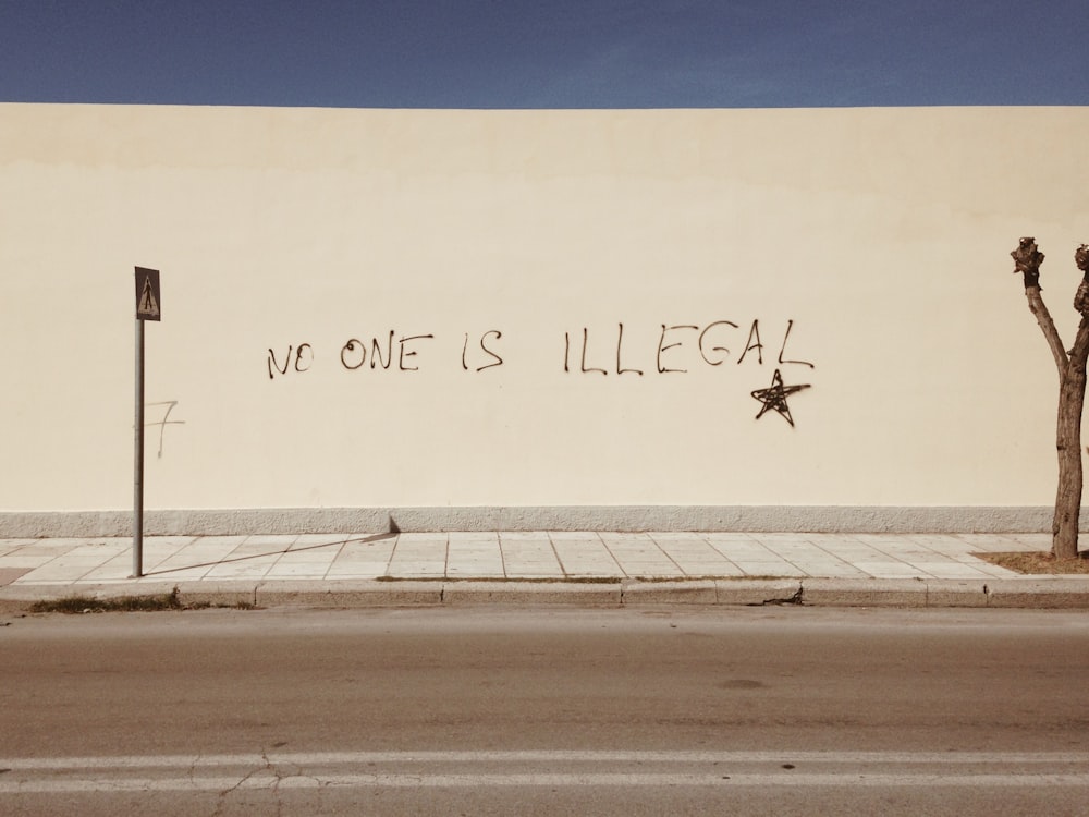 No one is illegal spray painted on wall