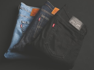 three assorted-color denim bottoms