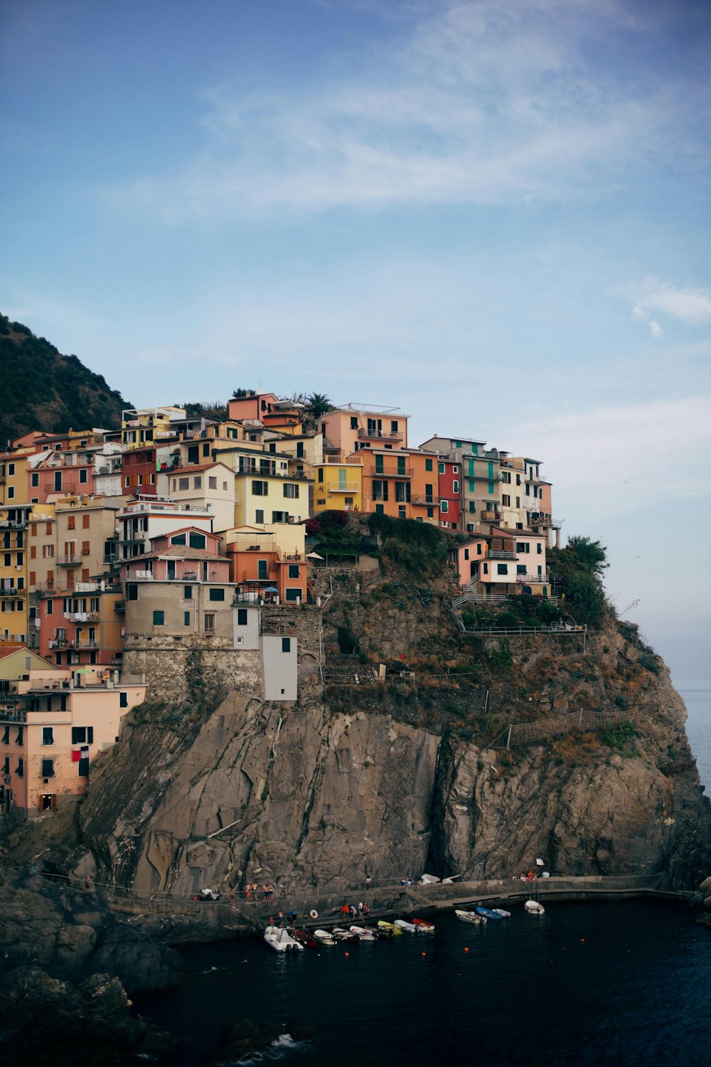 village on cliff during daytime