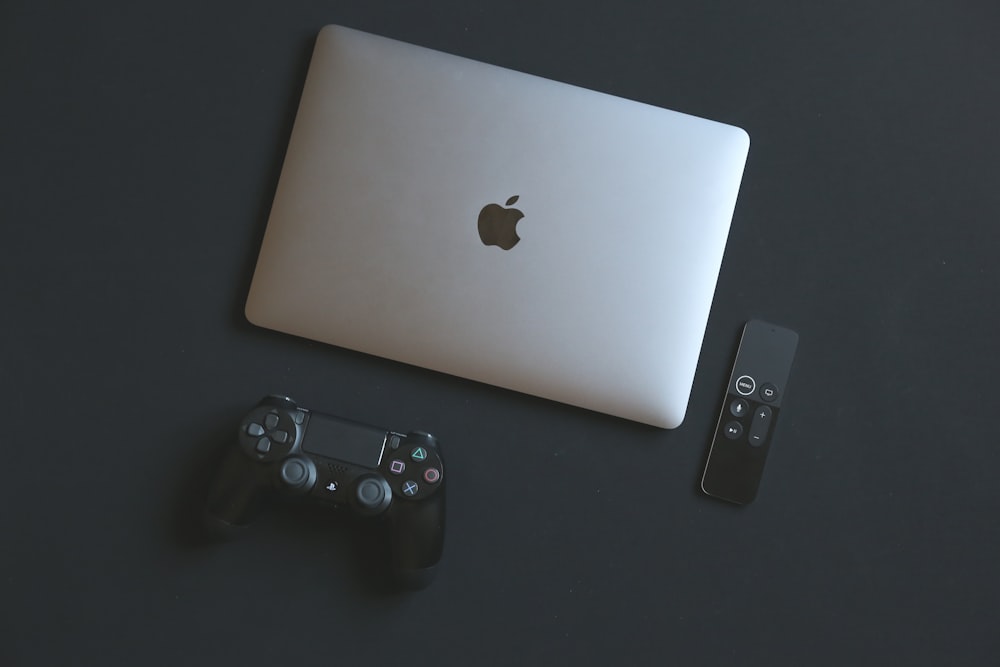 MacBook Pro and Sony PS4 controller photo – Free Portugal Image on Unsplash