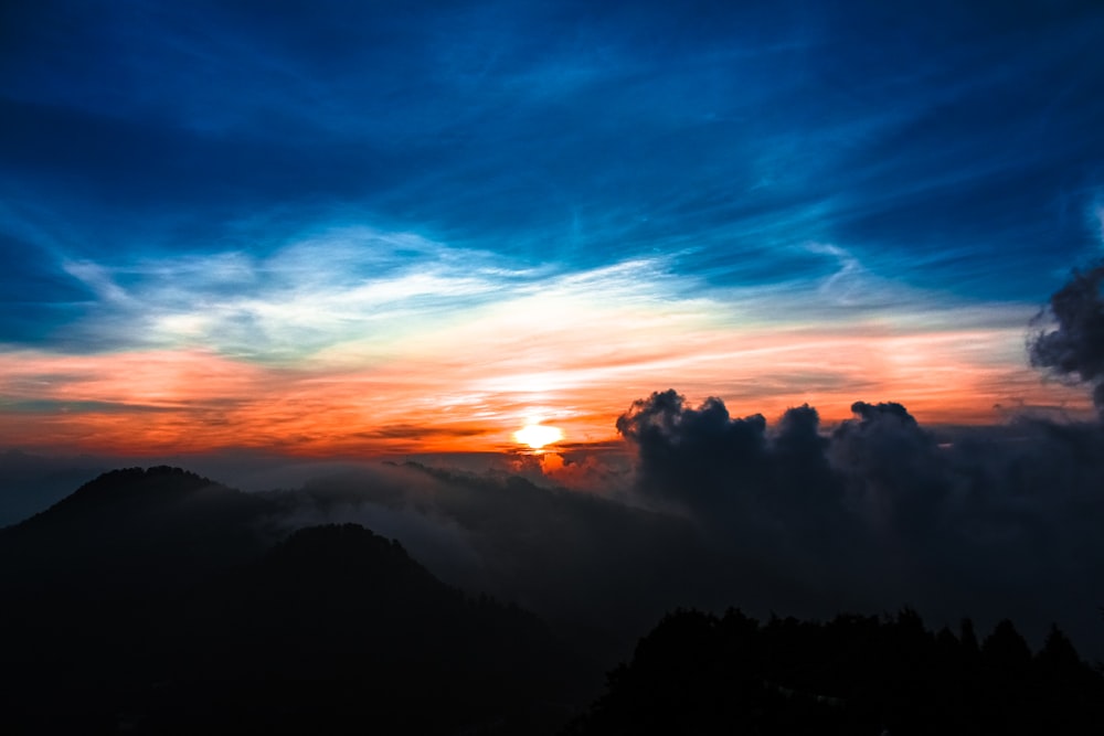 aerial photography of mountain and trees during golden hour