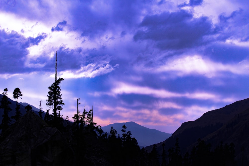 purple clouds over mountains