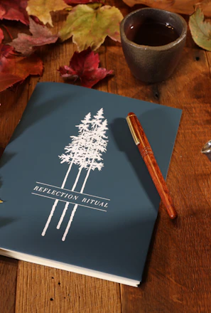 A serene scene of a person journaling beside a cup of tea, reflecting on relationship choices.