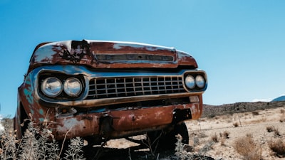 brown car on desert during day rust google meet background