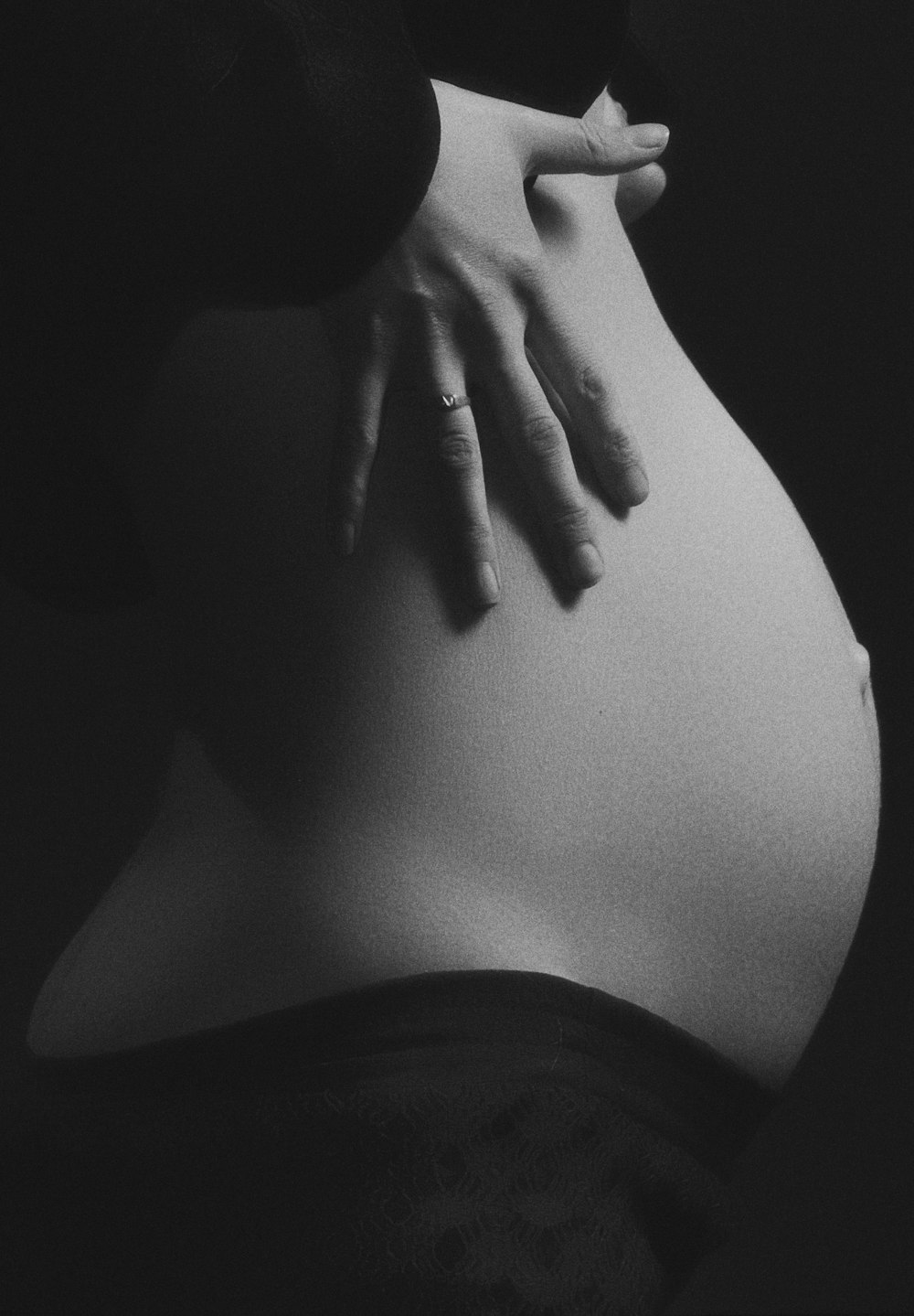 grayscale photo of pregnant woman