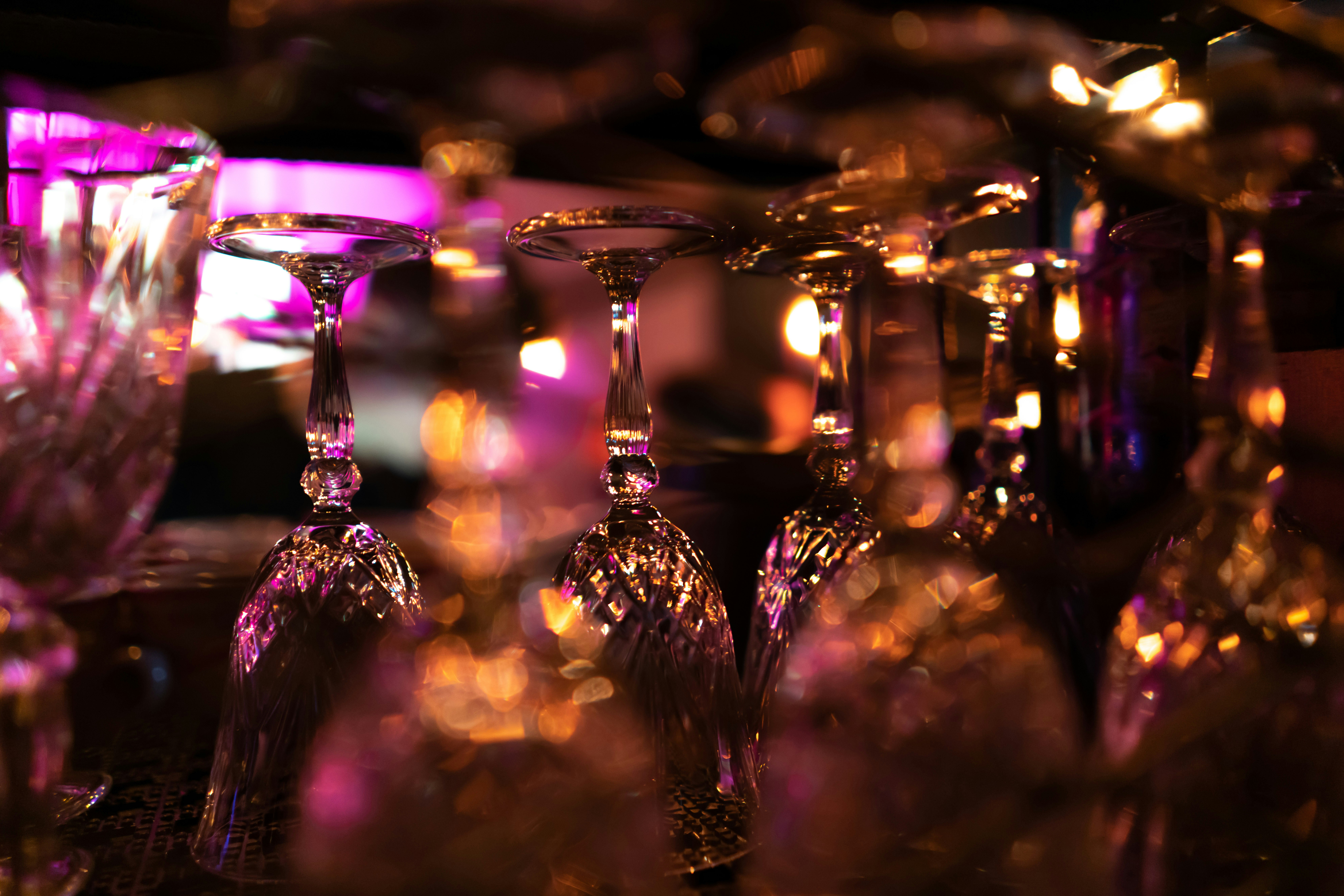 selective focus photography of clear glass stem glasses glass google meet background