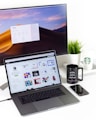 laptop near mug and computer monitor