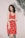 woman standing in front of white wall