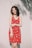 woman standing in front of white wall