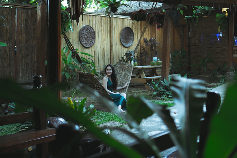 woman sitting on hammock on focus photography