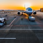 gray airplane on parking