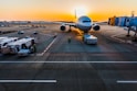 gray airplane on parking