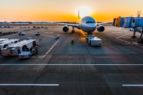 gray airplane on parking