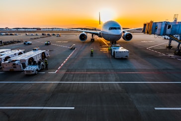 gray airplane on parking