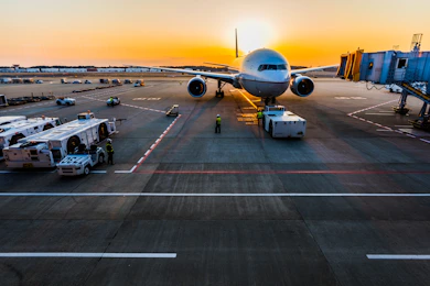 Commercial widebody airliner at the gate at sunset — visual reference for the 200-jet Boeing China order announced at the May 2026 Trump-Xi Beijing summit